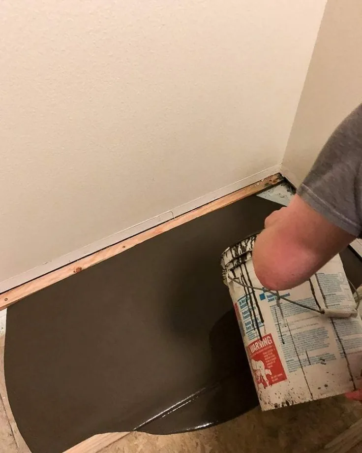 Subfloor being prepared along a wall before the new floor goes down