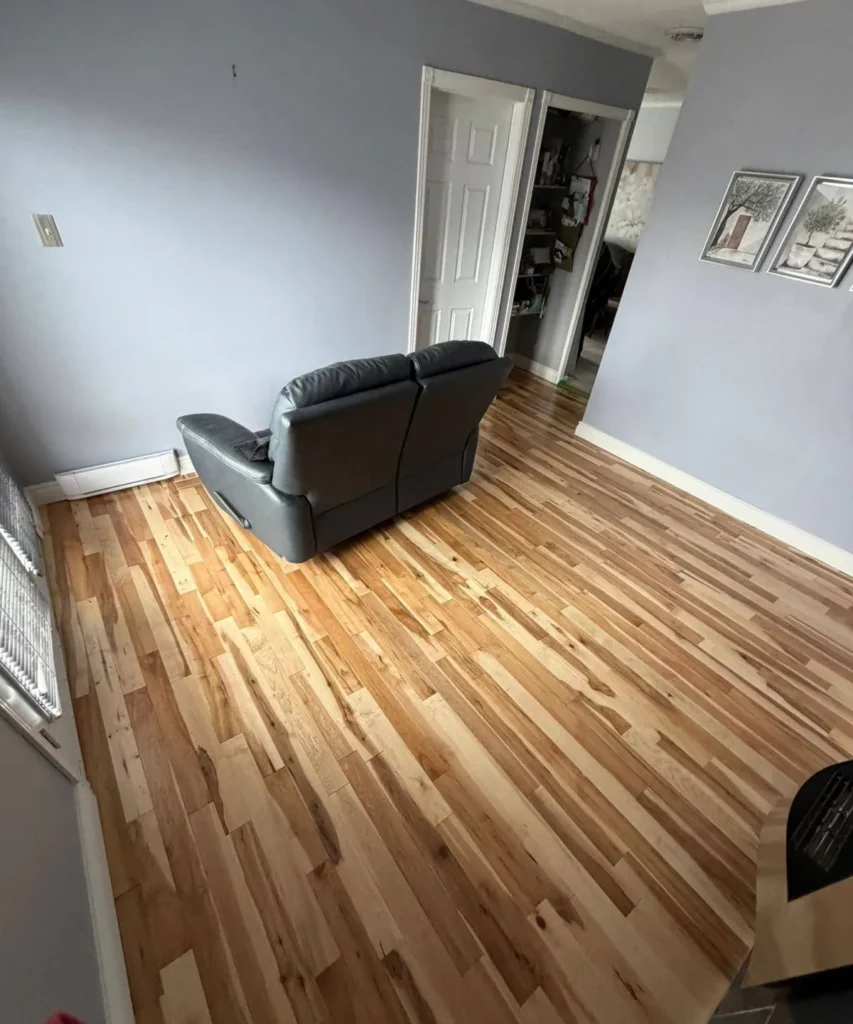 Newly installed multi-tone hardwood in a living room after water damage