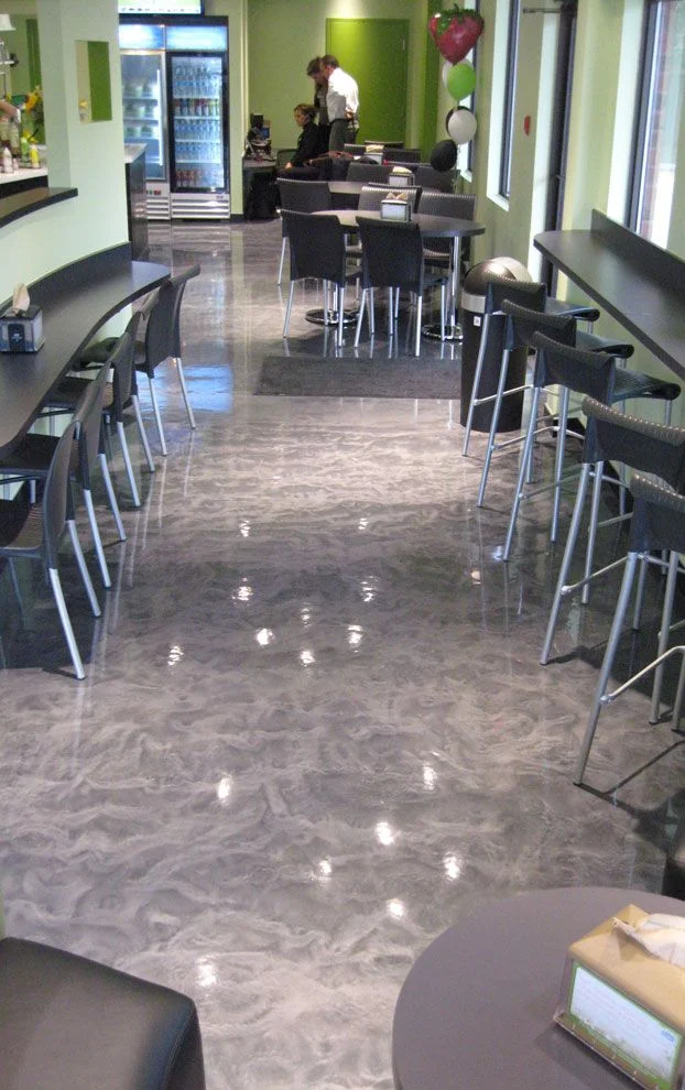 Grey metallic epoxy floor in a Calgary café dining area