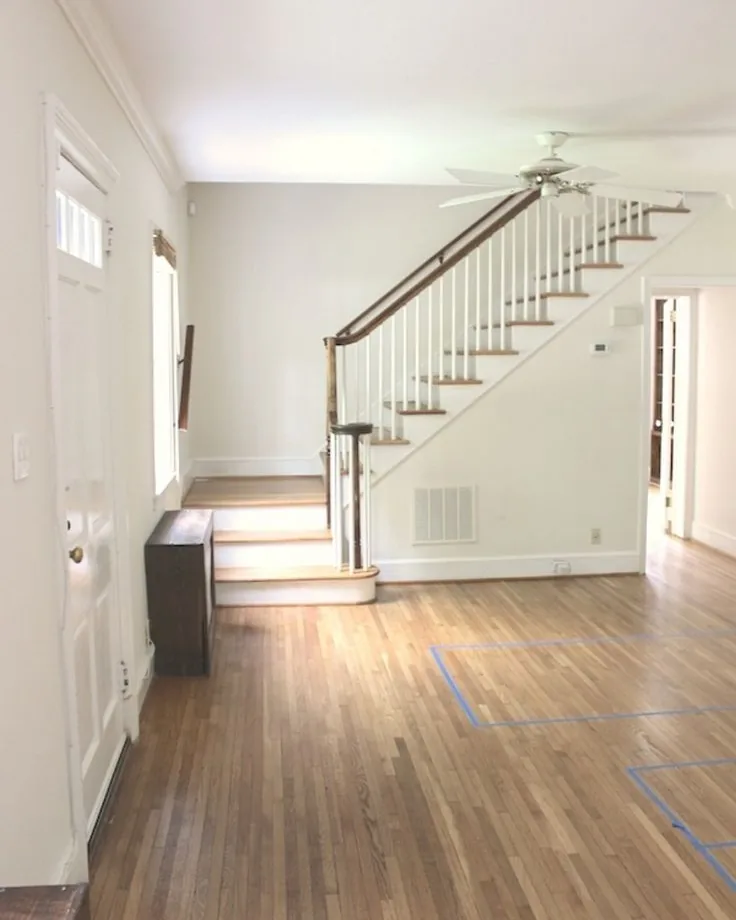Wood floor running from the front door to the staircase during the job